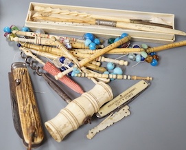 A collection of 19th century bone and ivory mounted penknives, bobbins etc